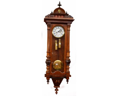 A Gustav Becker twin weight Vienna wall clock with walnut and stained beech case, white enamel dial and glazed door, length a