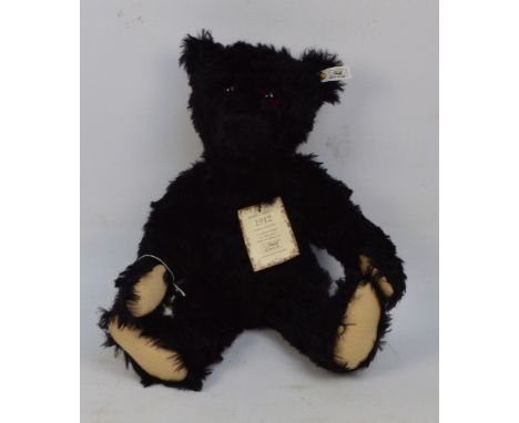 A boxed British Collectors' 1991 Steiff teddy bear no.406829, a replica of the 1912 Titanic mourning bear, with black distres