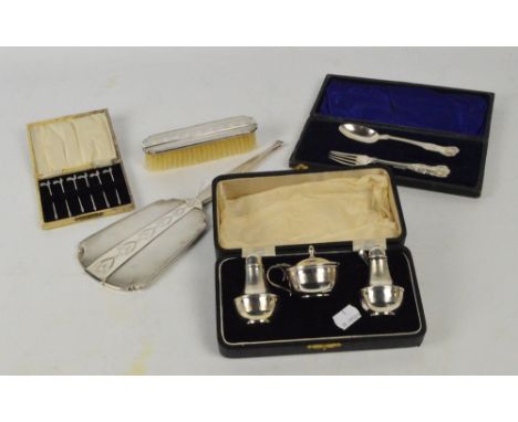 A small collection of hallmarked silver items comprising a cased three piece cruet of circular form with engine turned decora