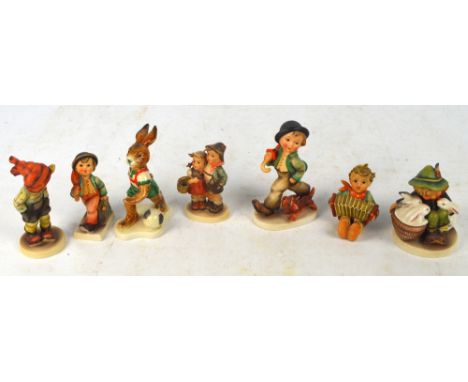 Seven Goebel Hummel figures.