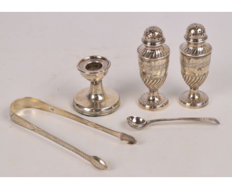 A pair of Victorian hallmarked silver urn shaped footed peppers with engraved and gadrooned decoration, Walker & Hall, Sheffi