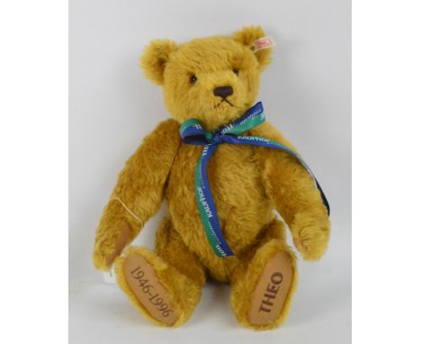 A boxed Steiff Theo teddy bear, no.655227, with numbered white and red tag to ear, with blonde mohair fur and "Theo" embroide