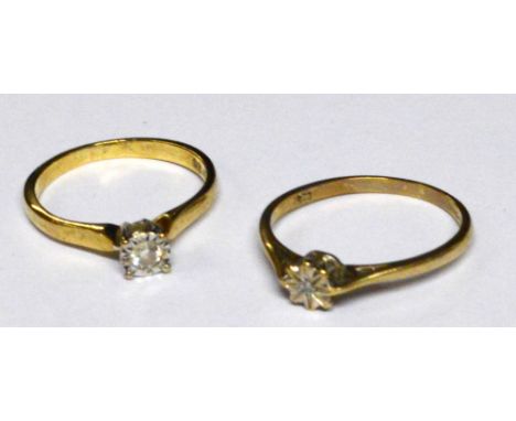 A 9ct yellow gold diamond ring, the central stone in claw setting above a six diamond chip coronet and pierced shoulders, siz