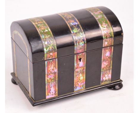 An early Victorian papier mâché and mother of pearl inlaid dome topped two division tea caddy raised on squat bun feet, width