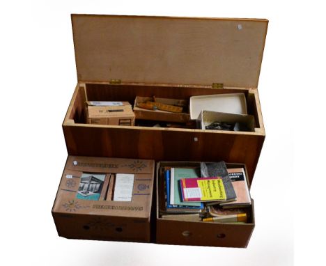 A collection of woodworking tools contained within a modern rectangular lidded box, and two boxes of books and magazines rela
