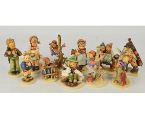 Eleven Goebel Hummel figures.