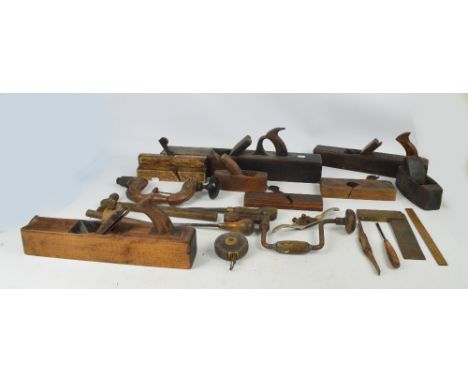 A quantity of various wooden planes, the largest length 56cm, also two hand drills, a chisel, etc.