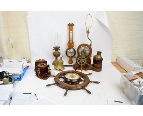 A collection of clocks including one modelled as a ship's wheel, a similarly decorated barometer/table lamp, a further wall c