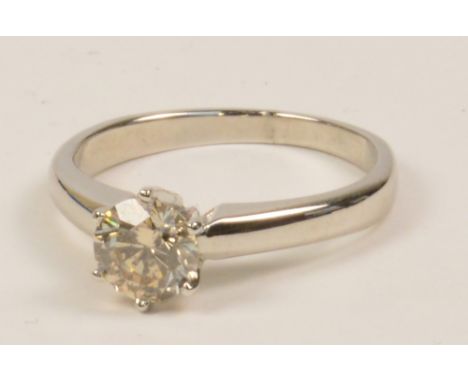 A 14ct white gold and diamond solitaire ring, the circular brilliant stone weighing approximately 1cts, in high claw mount, s