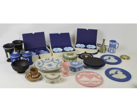 A large quantity of Wedgwood jasperware of varying colours including a pair of black trumpet vases, green trinket box and cov