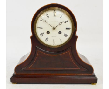 An Edwardian mahogany and boxwood strung eight day mantel clock, the circular white enamel dial inscribed "Lowe & Sons, Chest