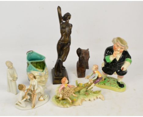 A mixed lot of ceramics, to include a Nao figure of a girl with chamberstick, a German figure group of two lovers, and a furt