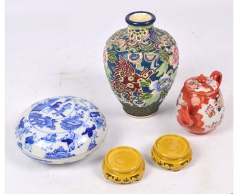 A late 19th/early 20th century Chinese circular box and cover painted in underglaze blue with central scene within figural bo