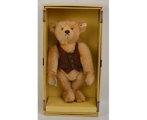 A boxed British Collectors' 1996 Steiff teddy bear no.654411, with numbered white and red tag to ear, with blonde mohair fur 