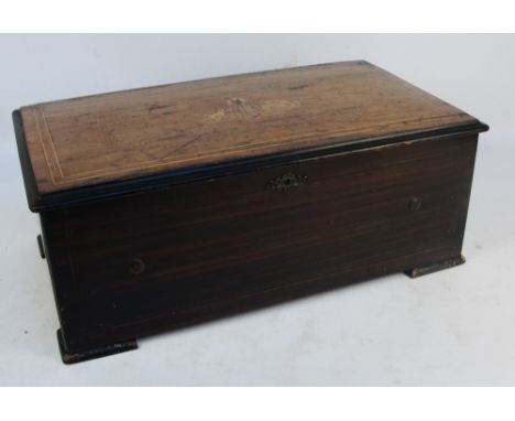 A late 19th century Swiss cylinder musical box playing twelve airs and striking on a drum, five bells and castanets, with ori