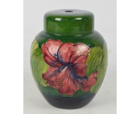 A Moorcroft lamp base in the "Hibiscus" pattern, impressed marks to base, height 21cm.