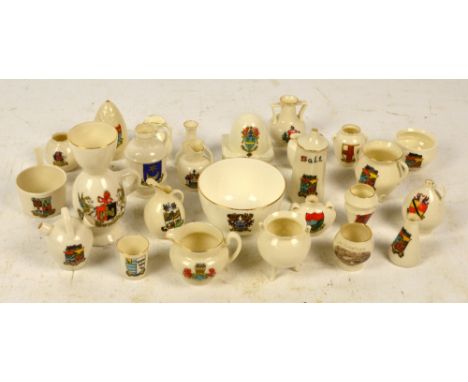 A collection of crested ware, predominantly Goss including Sandbach Beehive, butter dish, model of cinerary urn, jugs etc.