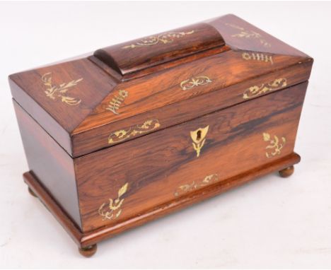 An early Victorian rosewood and mother of pearl inlaid sarcophagus shaped lidded box, formerly a tea caddy (lacking interior)