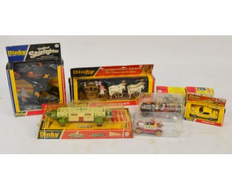 A collection of Dinky film, TV and novelty related vehicles including Trident Star Fighter 362, Cinderella's Coach 111, Santa