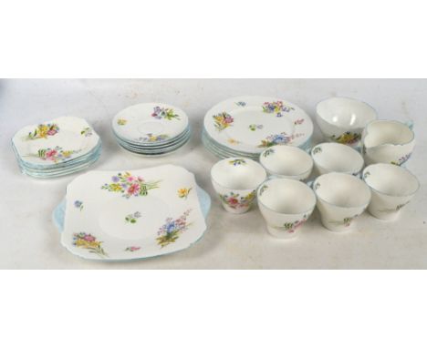 A Shelley part tea service in "Wild Flowers" pattern and Richmond shape 13668 comprising a sandwich plate, six dessert plates