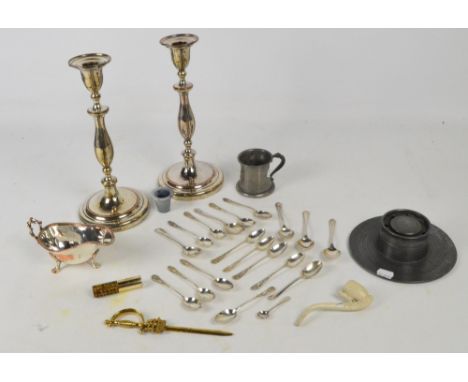 A small collection of plated items including a pair of circular candlesticks, a gravy boat, a number of teaspoons, also a pew