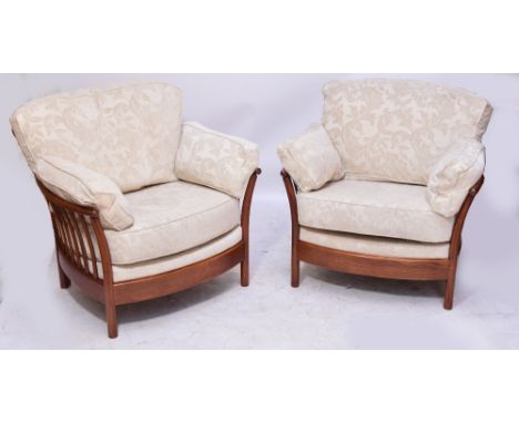 An Ercol three piece conservatory suite comprising a pair of armchairs and a two seater sofa, width 162cm, with beige upholst