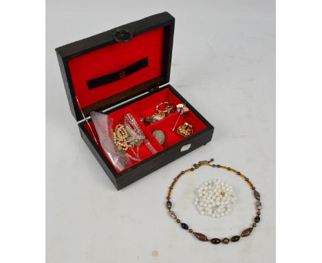 A small collection of costume jewellery comprising various bead necklaces including faux pearl example, group of brooches, al