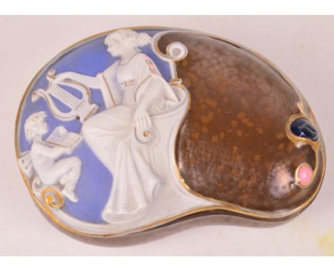 A German blue jasperware decorated kidney shaped brown and lustre glazed trinket box, manufacturers stamp to base, also marke