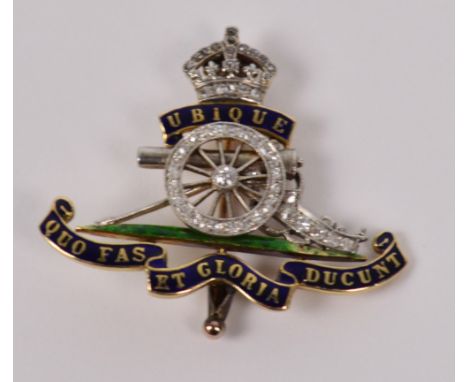 A yellow metal and diamond Royal Artillery brooch with enamel decoration and with spinning cannon wheel, in leather pouch, ap