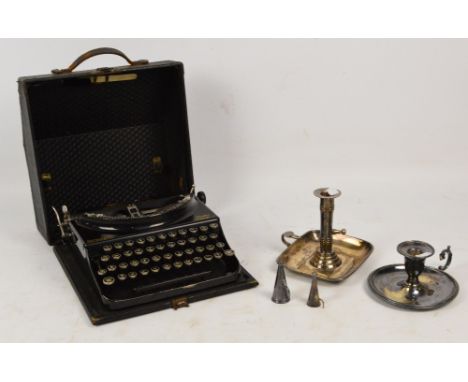 A cased Remington typewriter and two plated chambersticks (3).