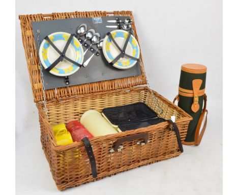 An Antler picnic hamper with four setting contents comprising plates, mugs, glasses, cutlery, two containers, and a flask, al