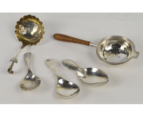 A George V hallmarked silver caddy spoon of plain form, Thomas Bradbury & Sons, Sheffield 1911, a further example with shell 