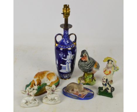 A mixed lot of ceramic figures to include a 19th century French bisque figure of a recumbent greyhound, three Staffordshire f
