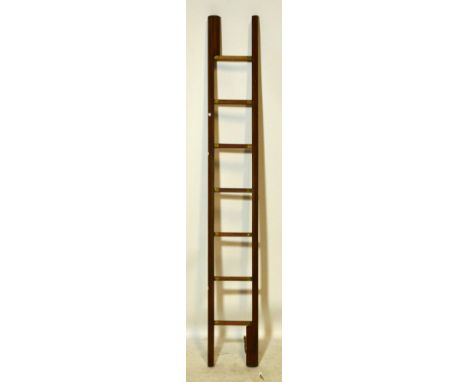 A reproduction mahogany folding pole library ladder. CONDITION REPORT: Appears in OK condition.