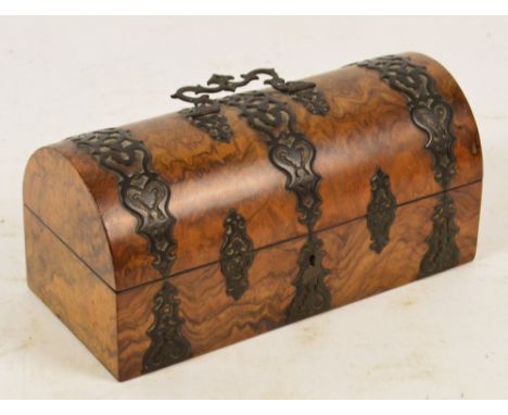 A Victorian figured walnut and strap bound dome topped trinket box, width 25.5cm.