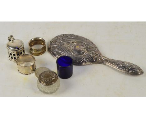 A small group of hallmarked silver items comprising a pierced decorated cylindrical mustard pot with blue glass liner, E.S. B