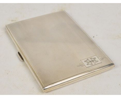 A George V hallmarked silver cigarette case rectangular form with overall engine turned decoration with rectangular cartouche