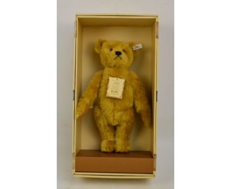 A boxed British Collectors' 1994 Steiff teddy bear no.406072, with numbered white and black tag to ear, with blonde mohair fu