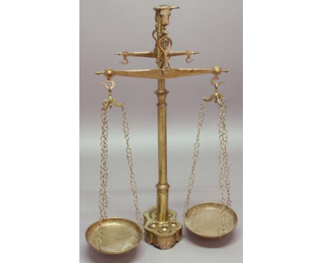 FRENCH BRASS BUTCHER'S SCALES,  late 19th century, with bull's head finial, two pairs of pans and the base fitted with a set 