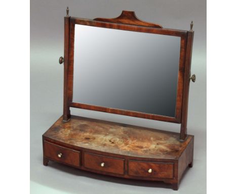 GEORGE III MAHOGANY TOILET MIRROR, the rectangular plate on a bow fronted base with three drawers, height 56cm, width 52cm, d