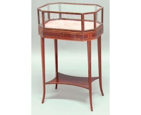 REGENCY STYLE MAHOGANY AND BOXWOOD INLAID BIJOUTERIE TABLE, the octagonal glazed and hinged top on outswept legs with shelf s