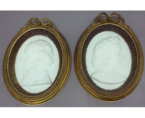 E E SEFLOWSKI, Pair of profile portrait busts of a Lady and Gentlemen, oval, white marble, signed lower left, 41cm x 29cm, in