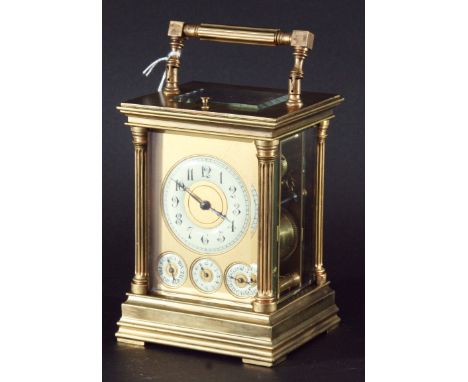 BRASS FOUR PANE CARRIAGE CLOCK the ivorine chapter ring above subsidiary dials, with a repeating eight day striking movement,