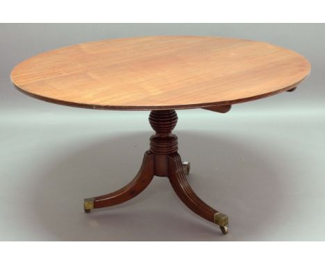 REGENCY MAHOGANY CIRCULAR TILT TOP BREAKFAST TABLE, reeded rim, ring turned column and tripod base, diameter 136cm, height 73