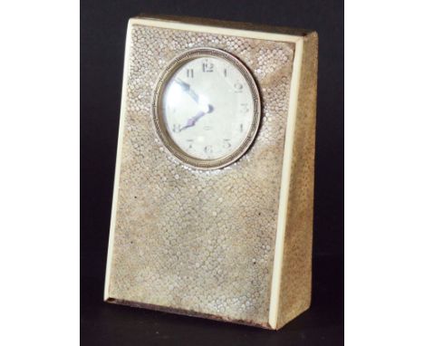 BEDSIDE TABLE CLOCK the Swiss made 15 jewels movement with silvered dial and Arabic numerals, in mottled shagreen case, heigh