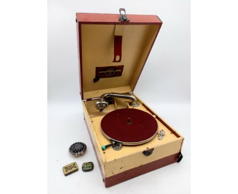 A Vintage Columbia gramophone, in painted case, with a spare head and two tins of needles.