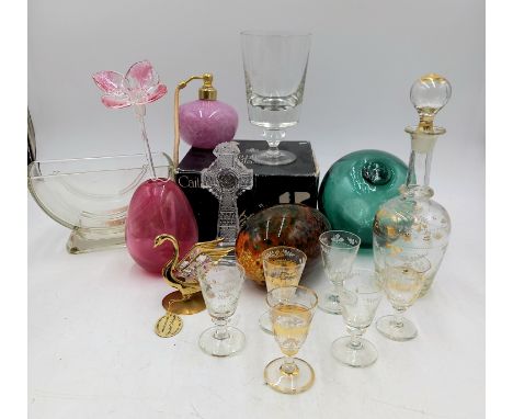 A collection of assorted glassware to include liqueur set, crystal Celtic cross, and a Monart style egg etc.