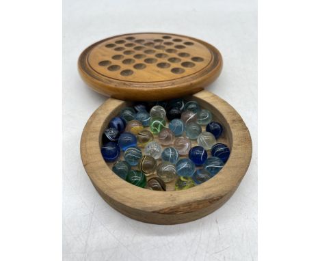 A vintage Solitaire set with marbles 