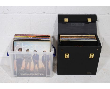 A quantity of various 12" vinyl records, including The Doors, David Bowie, Bob Dylan, Fleetwood Mac, Marc Bolan & T. Rex, The