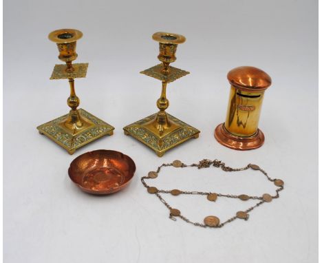 A small hand-beaten copper dish marked 'L R I Borrowdale', along with a pair of brass candlesticks, post box money bank and a